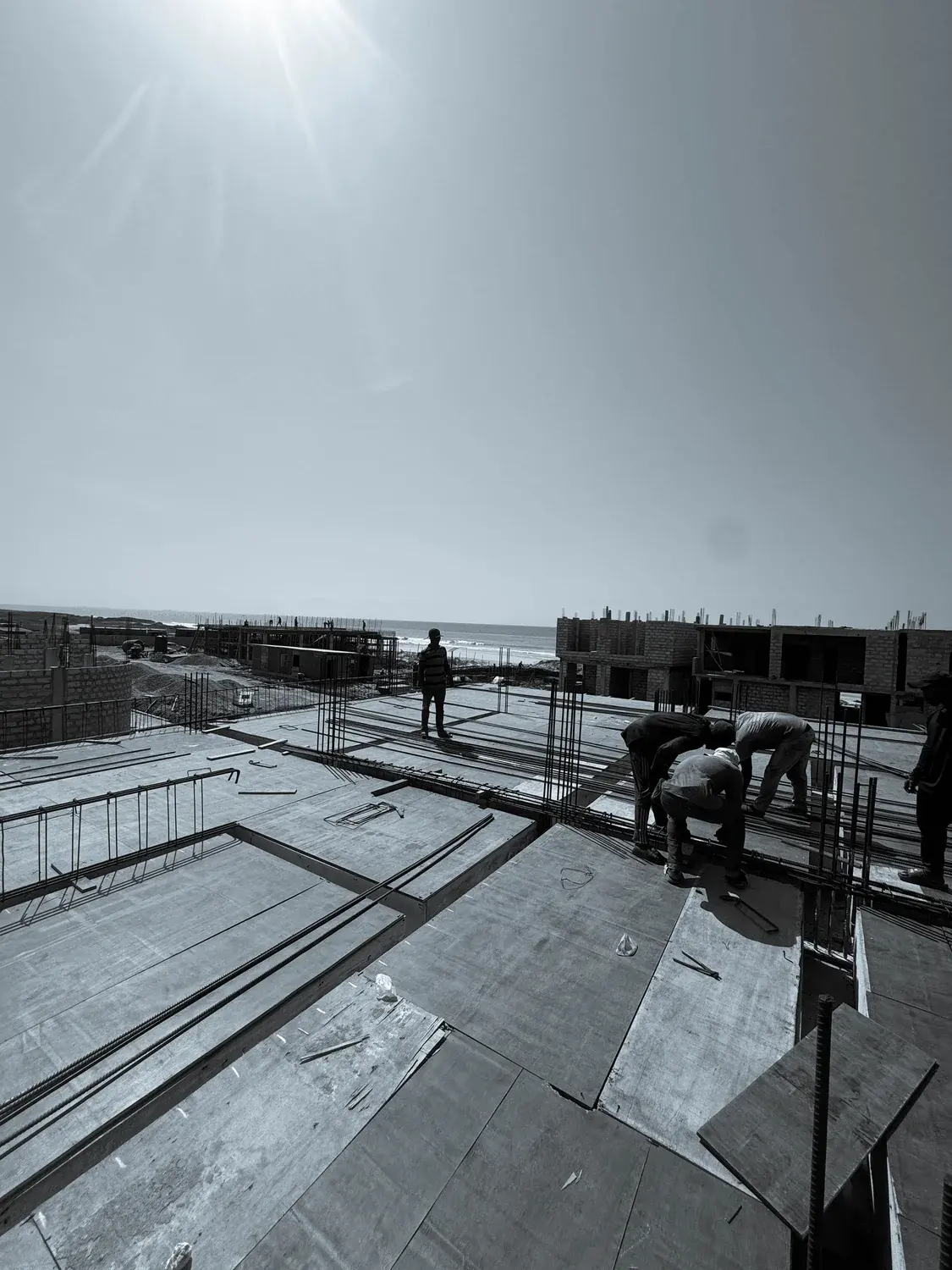 Construction crew laying steel reinforcement for the Oura by Bamboo slab
