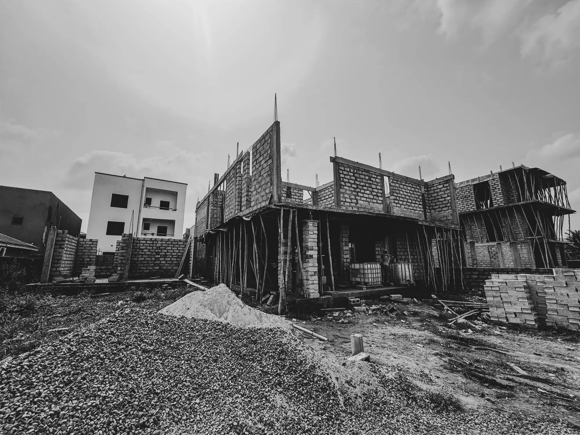 Vee’s House structure with upper-level block walls and temporary supports